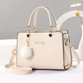 A Stylish Solid Color Handbag with Pom-Pom Decorations (Rs-1995)