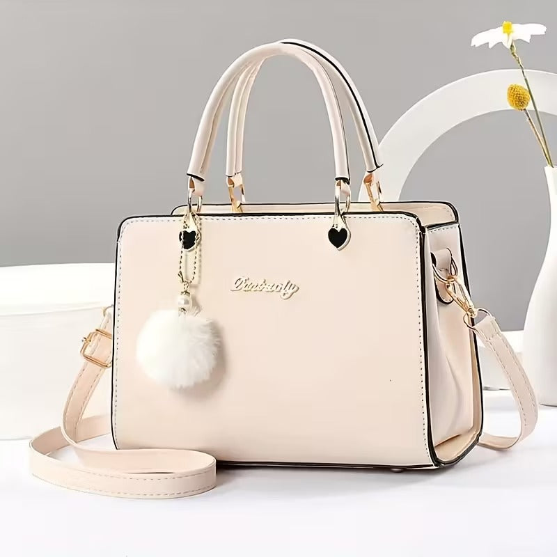 A Stylish Solid Color Handbag with Pom-Pom Decorations (Rs-1995)