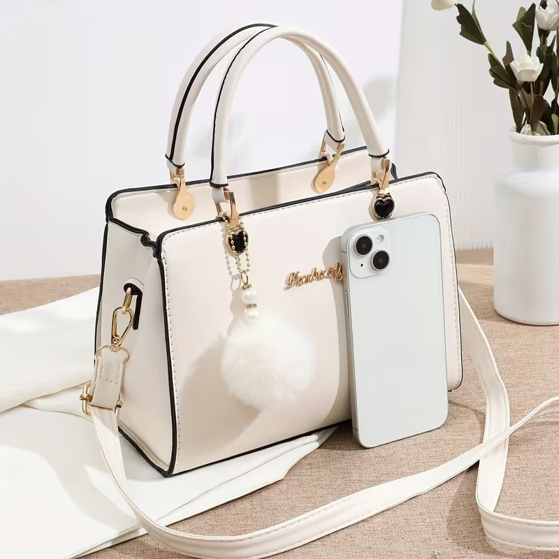 A Stylish Solid Color Handbag with Pom-Pom Decorations (Rs-1995)